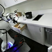 Robot workspace with the glue stick inside the open drawer